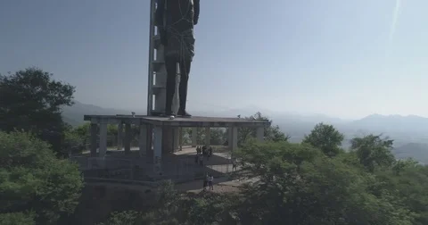 Aerial pulls back to reveal the Ecce Homo statue ontop a hill above Valledupar 스톡 동영상 78883382