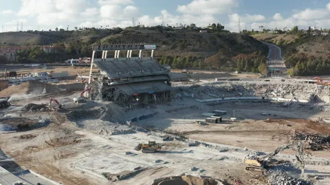 Aerial pulls back to reveal nearly complete demolition of Qualcomm stadium Stock Footage 150196057