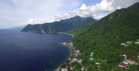 Aerial pulls back to reveal the town of Scott's Head on the south of Dominica Stock-Footage 70017843