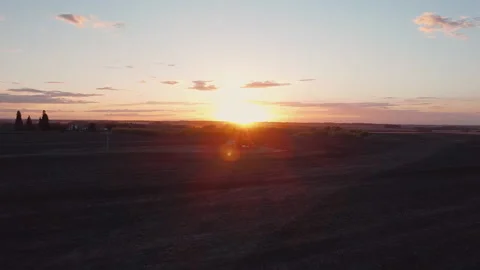 Aerial Pump Jack At Dusk Outlined by Sun Stock Footage 131284998