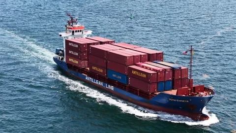 Aerial push in on Antillean Line container feeder ship off Miami coast Vídeo Stock 342649141