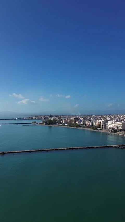 Aerial push in approaching , establishing vertical shot of Kalamata's port and Stock Footage 332626920