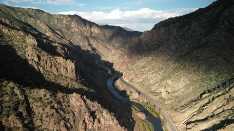 Aerial push forward through rocky canyon with Arkansas River in central Colorado Stock Footage 286245117