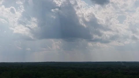 Aerial push forward toward rain shafts over forest in Oklahoma 스톡 동영상 332963248