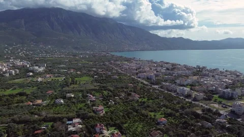 Aerial, push out raise up, establishing shot, sea of Kalamata, clouds over Stock Footage 341902964