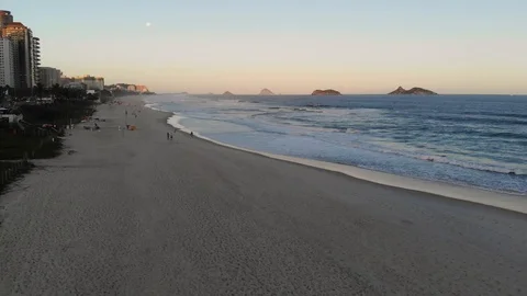 Aerial Push Out View Barra da Tijuca beach during sunset Stock Footage 90535826