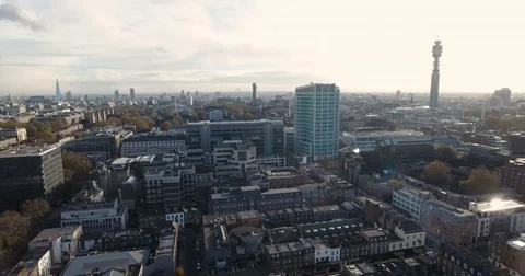 Aerial push out view of the skyline of  central London Stock Footage 70023597