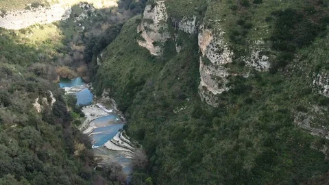 Aerial push out view of a small river at the bottom of a canyon Stock Footage 107215156