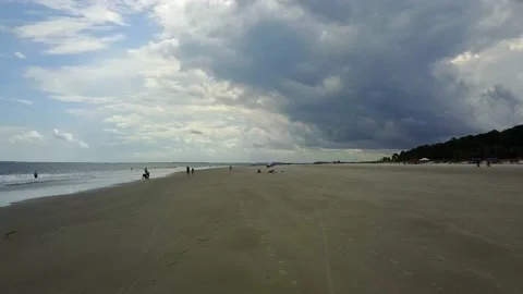 A Aerial push in over beach with people Stock Footage 155459451