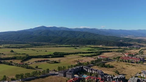 Aerial Push In Over Razlog Resort Buildings and Pirin Mountains Bulgaria Stock Footage 343795463