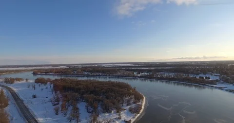 Aerial push over river and trees in winter Stock Footage 86297566