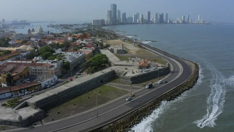 Aerial push-in over Santo Domingo Plaza and old town walls Cartagena Colombia Stock Footage
