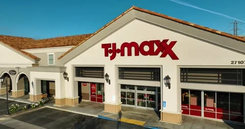 Aerial push in right side store front TJ Max - TJ Maxx, exterior entrance Stock Footage 240574957
