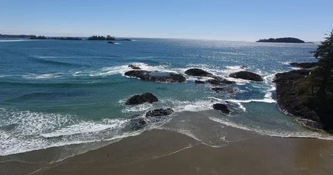 Aerial Push Shot of waves breaking on rocks Stock Footage 106848458