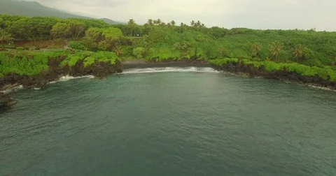 Aerial Push Into From Static Shot Black Sand Beach Stock Footage 75070372