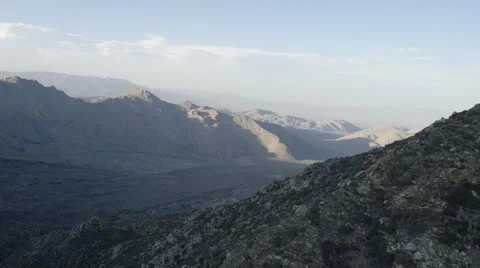 Aerial push Through Mountain Valley Over Ridge Stock Footage 59101090