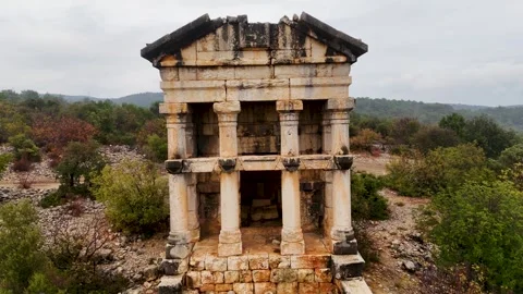 Aerial Push-In Toward Ancient Stone Mausoleum in Natural Landscape, Mersin Stock Footage 324139037