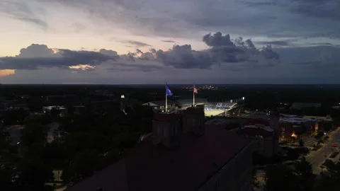 Aerial Push Toward the Flags of Fraser Hall at KU Video stock 337970280
