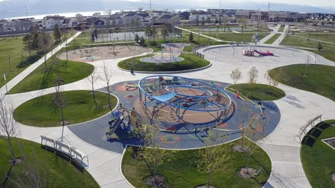 Aerial push in towards playground and splash pad closed due to coronavirus 2020 Stock Footage 128782838