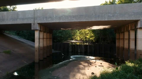 Aerial push under a sinister looking bridge scene Video stock 96347035