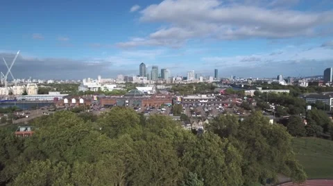 Aerial push in view of the financial district of the Docklands in London Stock Footage 68580446