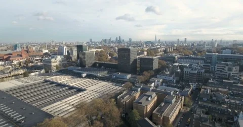 Aerial push in view over Euston station towards the City of London Stock-Footage 70023266