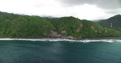 Aerial pushes in and over Wavin Cyrique waterfall in Dominica Stock-Footage 70340122