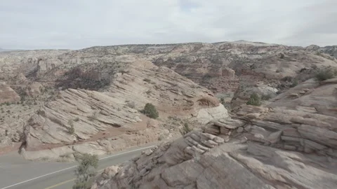 Aerial pushes low through rocks to reveal canyon near Escalante, Utah Vídeos de archivo 303390652