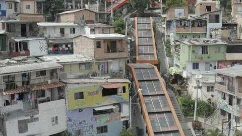 Aerial pushes up the orange escalators of Comuna 13 neighborhood in Medellin Stock-Footage 105624475