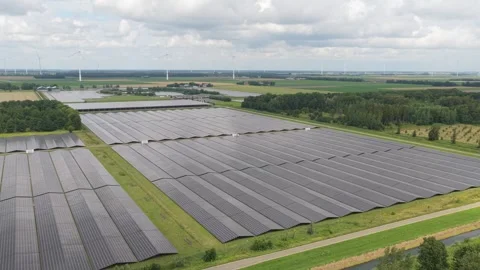 Aerial PV arrays over fields, renewable electricity production, Netherlands Stock Footage 315850705