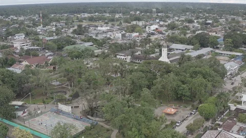 Aerial quickly circles the Parque Santander of Leticia, Amazonas in Colombia Stock Footage 127580755