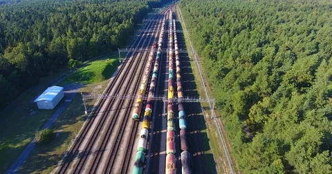 AERIAL railway: Long cargo train wagons station bend - 1 Vídeo Stock 80478506