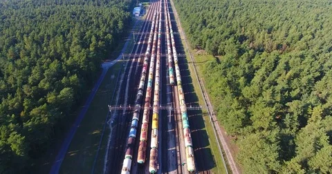 AERIAL railway: Long cargo train wagons station bend - 3 Stock Footage 80480147