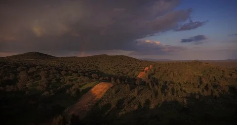 AERIAL - Rainbow over pastures dramatic landscape Video stock 97978036