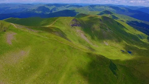 Aerial of a range with one peak having a pyramid side in the Carpathians in Stock Footage 93667664