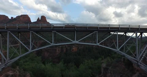 Aerial rapid pull back from a bridge in desert landscape Video stock 57923580