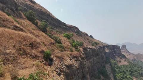 Aerial of Ratangad cliffs and dry slopes Maharashtra India Stockbeeldmateriaal 341128252