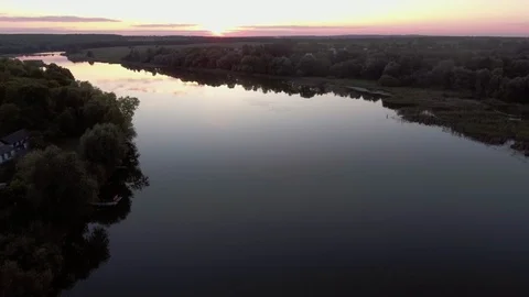 Aerial real Backwards View Beautiful Flight over the River in the Background Stock Footage 85695271