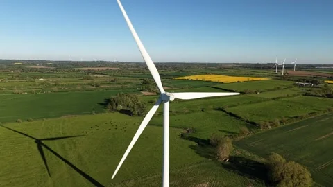 Aerial Rear View of Rotating Wind Turbine Over Countryside Stock-Footage 333936981