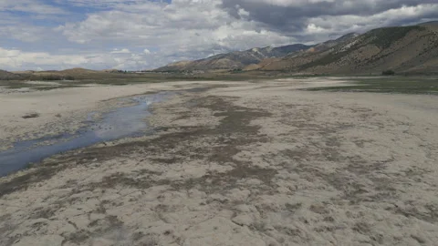Aerial-Record drought reduces central Utah reservoir to a mere trickle Stock Footage 204536586