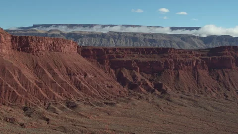 Aerial of red cliffs and low cloud inversion in St George Utah desert in morning Stock Footage 264113341