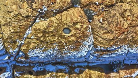 Aerial Red Rock Snow Patterns and Frozen Water Pool Nevada Top Down Stock Photos