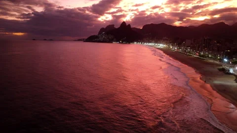 Aerial of Red Sunset in the Rio de Janeiro Ipanema Beach, drone 4K Stock Footage 200314891