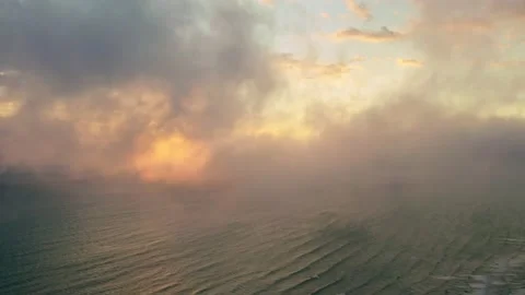 Aerial relaxing video through the clouds looking at the sea, 4K italy Stock Footage 226245529