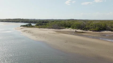 Aerial remote beach low tide at inlet 4k drone Stock Footage 253345694