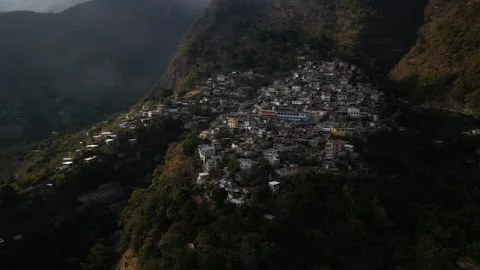 Aerial of remote mountain town around Lake Atitlan in Guatemala Stock Footage 329012016