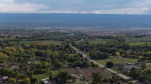 Aerial of residential development in Eckert Colorado in autumn with mountains Stock Footage 347310089