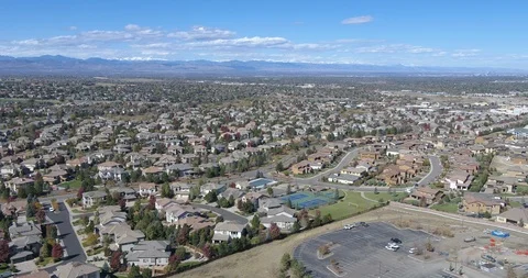 Aerial Residential Neighborhood with Mountains in view Denver CO Stock Footage