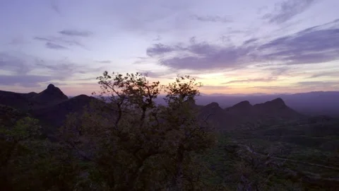 Aerial reveal of dramatic desert mountains at dusk Stock Footage 240029183