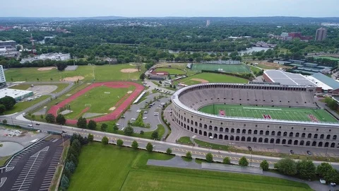 Aerial reveal Harvard sports fields Massachusetts USA Stock Footage